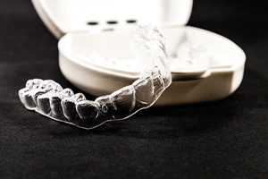 Clear aligner by travel case.